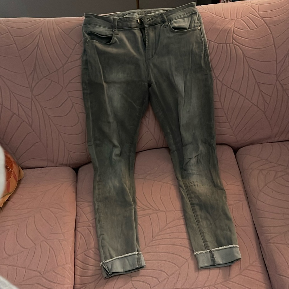 Size 28, light gray wash skinny jeans, rolled at bottom